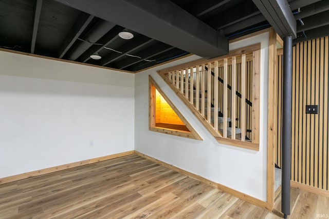 stairs with baseboards and wood finished floors
