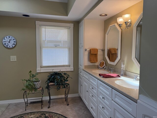 2110 Denson Ave, Bedford, IN 47421 - bathroom with double vanity, baseboards, and tile patterned floors