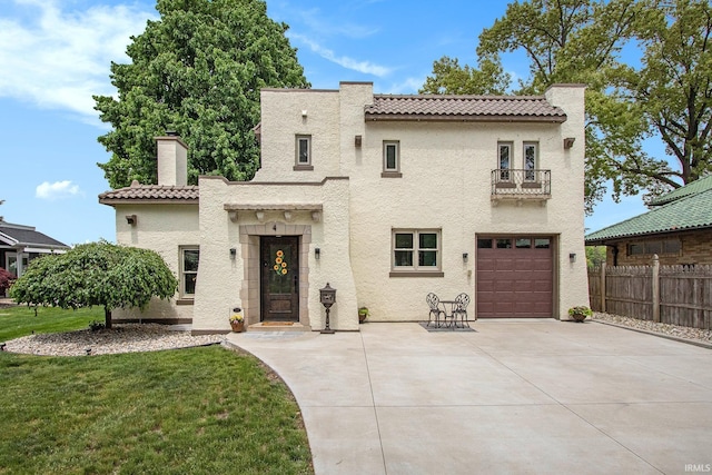 4 Edgewater Pl, Elkhart, IN 46516 - mediterranean / spanish home featuring a balcony, stucco siding, a chimney, concrete driveway, and a garage