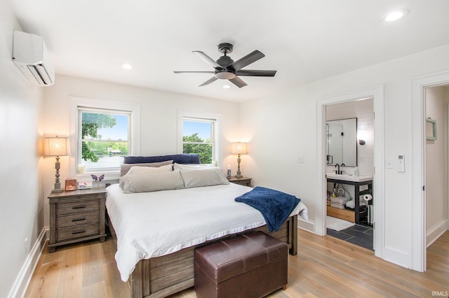 4 Edgewater Pl, Elkhart, IN 46516 - bedroom featuring an AC wall unit, light wood finished floors, recessed lighting, baseboards, and a ceiling fan