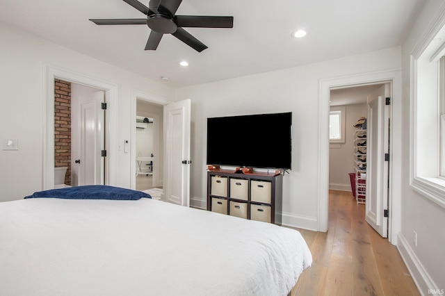 4 Edgewater Pl, Elkhart, IN 46516 - bedroom with light wood-type flooring, baseboards, recessed lighting, a ceiling fan, and ensuite bath