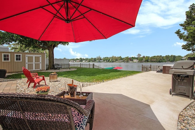 4 Edgewater Pl, Elkhart, IN 46516 - view of patio / terrace with a water view, an outbuilding, a shed, and grilling area