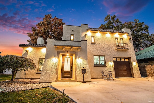 4 Edgewater Pl, Elkhart, IN 46516 - mediterranean / spanish home featuring a balcony, stucco siding, a tiled roof, a chimney, and driveway