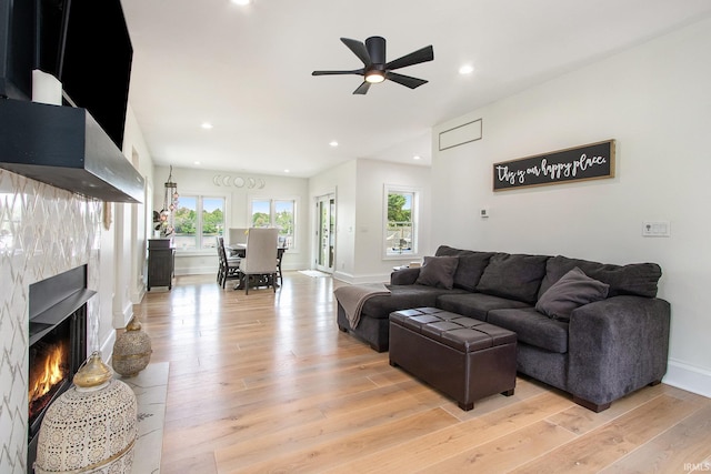 4 Edgewater Pl, Elkhart, IN 46516 - living room featuring ceiling fan, a fireplace, light wood-type flooring, baseboards, and recessed lighting