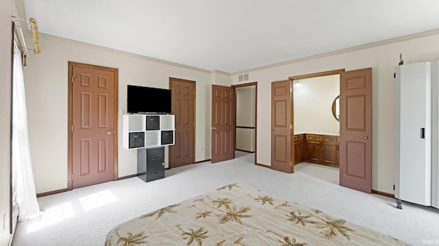 unfurnished bedroom with light colored carpet, ornamental molding, and baseboards