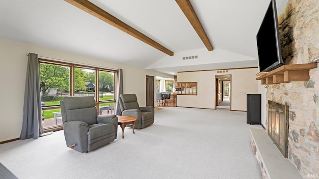 living area featuring light carpet, a fireplace, and baseboards