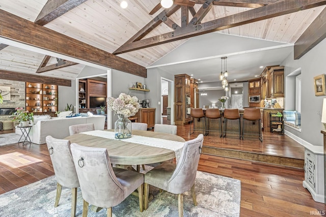 dining space featuring hardwood / wood-style floors, wooden ceiling, and recessed lighting