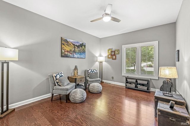sitting room featuring ceiling fan, wood finished floors, and baseboards