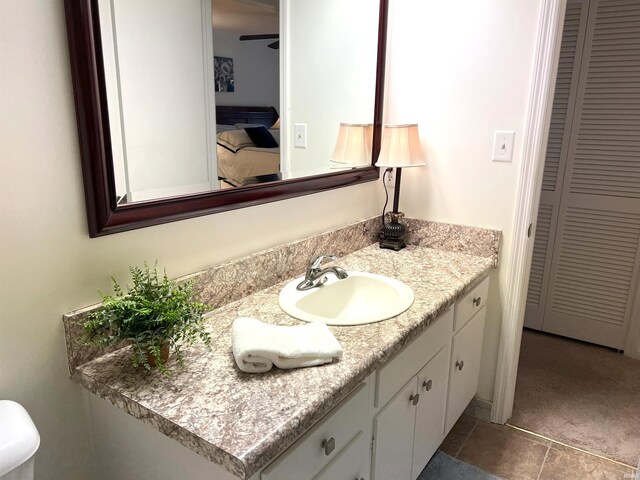 4501 N Wheeling Ave Unit 2-303, Muncie, IN 47304 - bathroom featuring a closet, vanity, and tile patterned floors