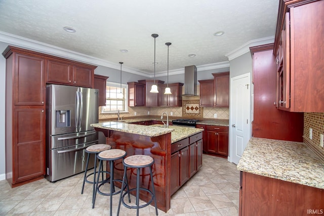 3905 Rushgrove Dr, Lafayette, IN 47909 - kitchen with appliances with stainless steel finishes, wall chimney range hood, reddish brown cabinets, an island with sink, and crown molding