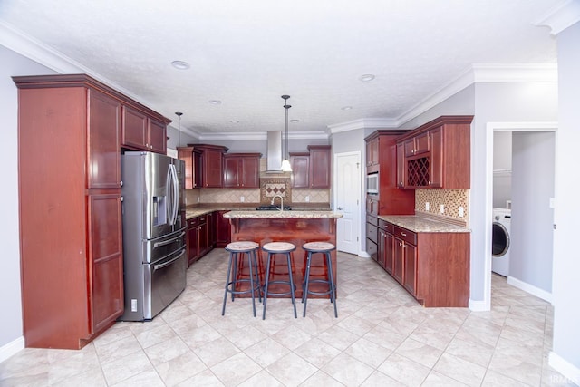 3905 Rushgrove Dr, Lafayette, IN 47909 - kitchen with stainless steel fridge, reddish brown cabinets, washer / clothes dryer, decorative backsplash, and recessed lighting