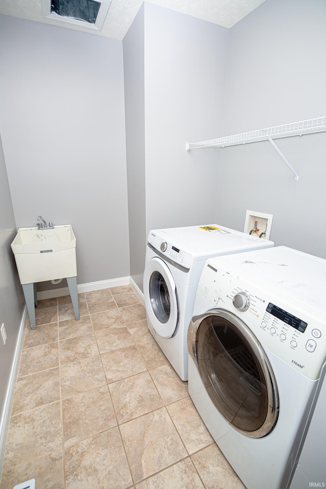 3905 Rushgrove Dr, Lafayette, IN 47909 - clothes washing area with washing machine and clothes dryer and baseboards