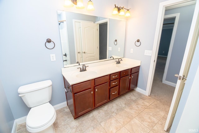 3905 Rushgrove Dr, Lafayette, IN 47909 - bathroom with toilet, double vanity, and baseboards
