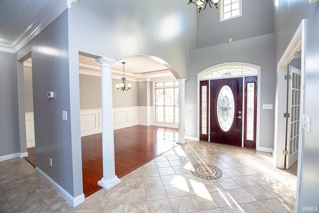3905 Rushgrove Dr, Lafayette, IN 47909 - entrance foyer with a chandelier, healthy amount of natural light, decorative columns, arched walkways, and ornamental molding
