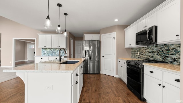 5937 Liam Ln, Fort Wayne, IN 46818 - kitchen with stainless steel fridge, double oven range, a sink, decorative backsplash, and an island with sink