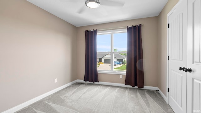 5937 Liam Ln, Fort Wayne, IN 46818 - unfurnished room with baseboards, light carpet, a ceiling fan, and healthy amount of natural light