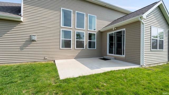 5937 Liam Ln, Fort Wayne, IN 46818 - rear view of property featuring a yard, a patio, and a shingled roof