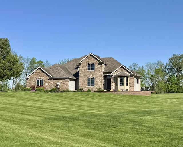16529 State Road 1st Rd, Spencerville, IN 46788 - view of front of house featuring a front yard, roof with shingles, and brick siding