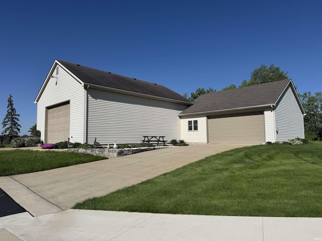 16529 State Road 1st Rd, Spencerville, IN 46788 - view of property exterior featuring a garage, a yard, and an outdoor structure