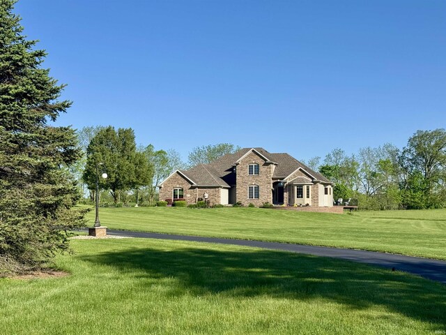 16529 State Road 1st Rd, Spencerville, IN 46788 - view of front facade featuring a front lawn and stone siding