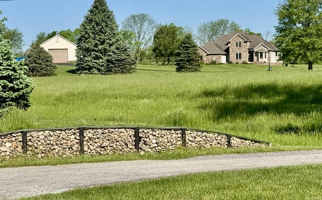 16529 State Road 1st Rd, Spencerville, IN 46788 - view of grassy yard featuring a detached garage