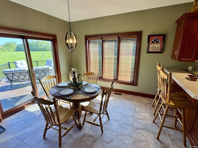 16529 State Road 1st Rd, Spencerville, IN 46788 - dining space featuring a chandelier, baseboards, light tile patterned floors, and lofted ceiling