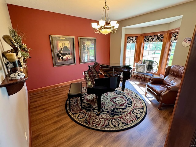 16529 State Road 1st Rd, Spencerville, IN 46788 - dining space featuring wood finished floors, a chandelier, and baseboards