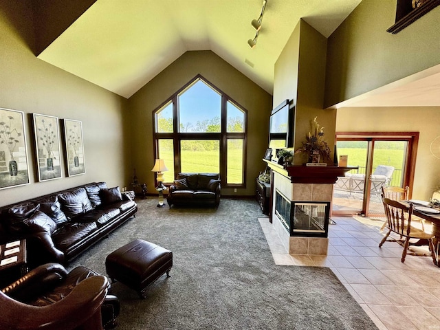 16529 State Road 1st Rd, Spencerville, IN 46788 - living area featuring a tiled fireplace, carpet floors, high vaulted ceiling, and tile patterned flooring
