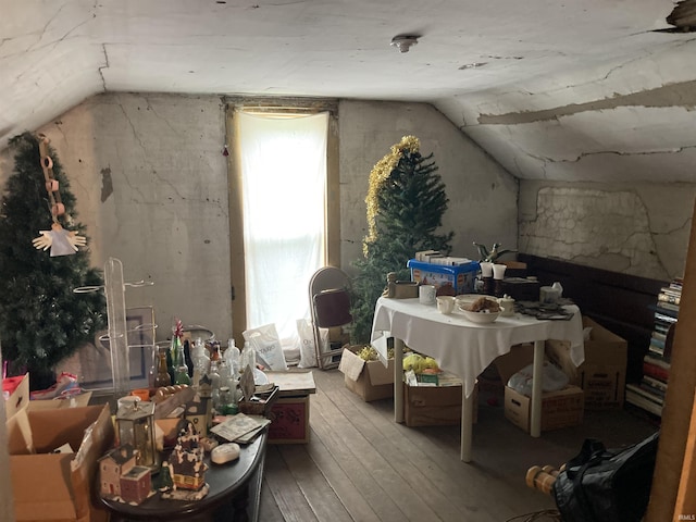 bonus room featuring vaulted ceiling and wood-type flooring