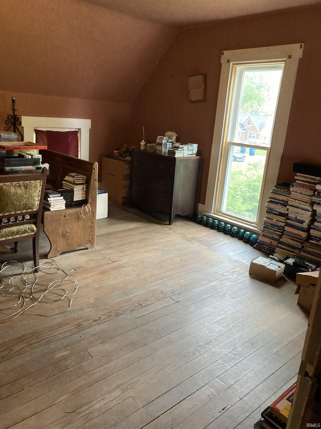 bonus room featuring lofted ceiling and hardwood / wood-style floors