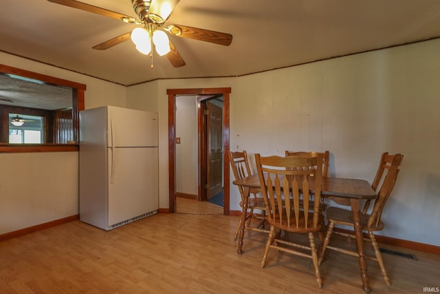 511 Pearl St, Rockport, IN 47635 - dining area featuring light wood-style floors, a ceiling fan, and baseboards