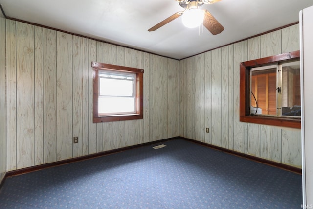 511 Pearl St, Rockport, IN 47635 - carpeted empty room with a ceiling fan