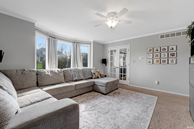 10731 Willow Creek Dr, Fort Wayne, IN 46845 - living area featuring ornamental molding, ceiling fan, plenty of natural light, french doors, and carpet floors