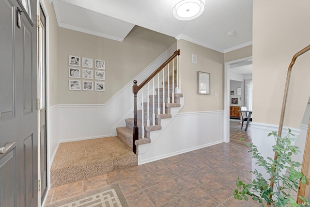 10731 Willow Creek Dr, Fort Wayne, IN 46845 - foyer entrance with stairway, ornamental molding, and baseboards