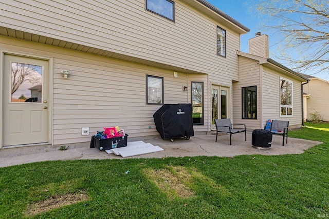 10731 Willow Creek Dr, Fort Wayne, IN 46845 - back of house with a chimney, a patio area, and a lawn