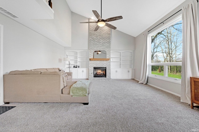 10731 Willow Creek Dr, Fort Wayne, IN 46845 - living room featuring ceiling fan, high vaulted ceiling, carpet floors, a fireplace, and built in shelves