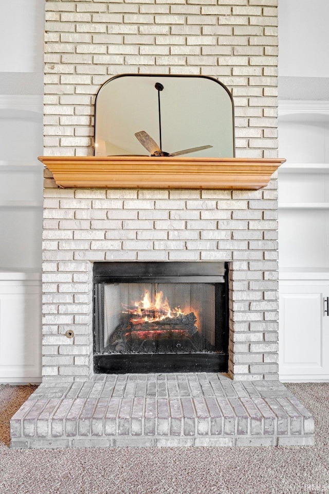 10731 Willow Creek Dr, Fort Wayne, IN 46845 - detailed view of a fireplace, ceiling fan, and carpet