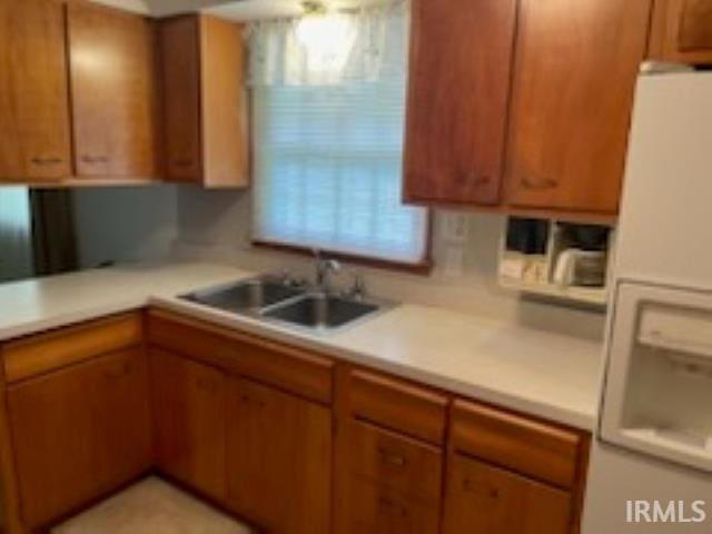 206 Pine St, Vincennes, IN 47591 - kitchen with white fridge with ice dispenser, a sink, and light countertops