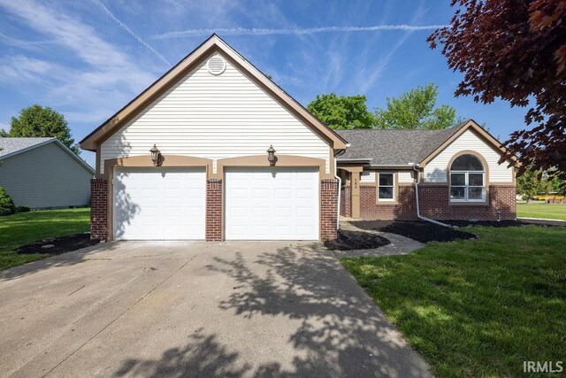 103 Bluebird Ln, Sulphur Springs, IN 47388 - single story home with brick siding, driveway, a front lawn, and a garage