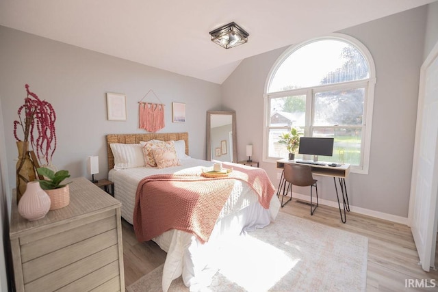 103 Bluebird Ln, Sulphur Springs, IN 47388 - bedroom featuring light wood-style flooring, lofted ceiling, and baseboards