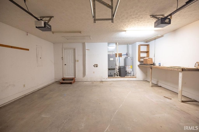103 Bluebird Ln, Sulphur Springs, IN 47388 - garage featuring a garage door opener, gas water heater, heating unit, and a workshop area