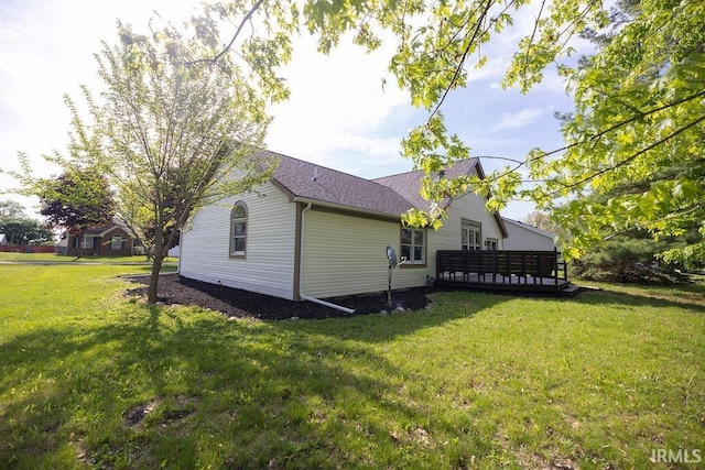 103 Bluebird Ln, Sulphur Springs, IN 47388 - rear view of house with a lawn, roof with shingles, and a wooden deck
