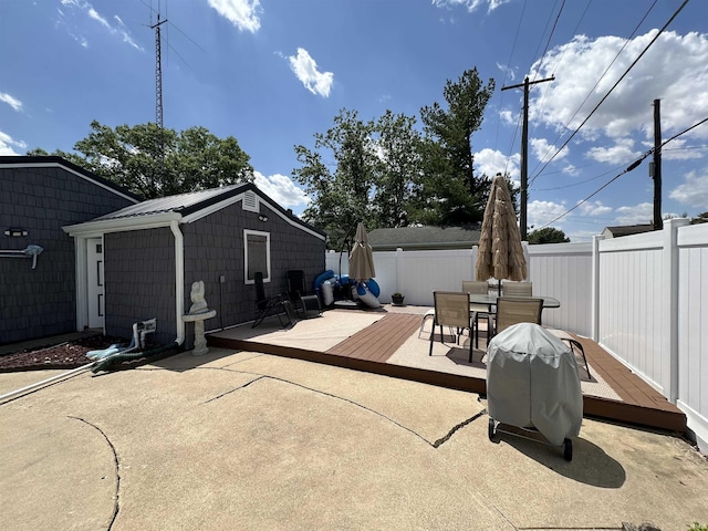 134 E 3rd St, Peru, IN 46970 - view of patio / terrace featuring fence, outdoor dining space, and a deck