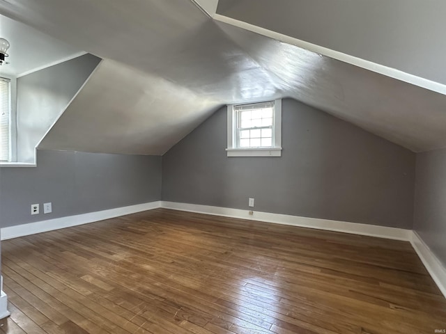 134 E 3rd St, Peru, IN 46970 - bonus room featuring wood-type flooring, baseboards, and lofted ceiling