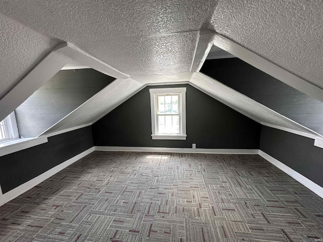 134 E 3rd St, Peru, IN 46970 - bonus room featuring a textured ceiling, carpet floors, and lofted ceiling