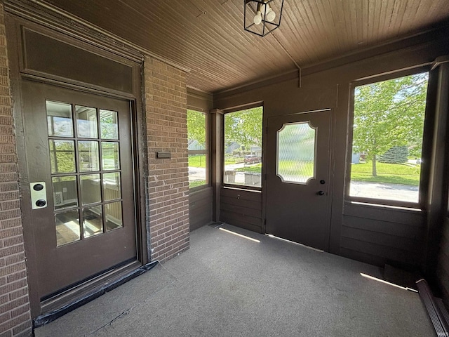 unfurnished sunroom with healthy amount of natural light