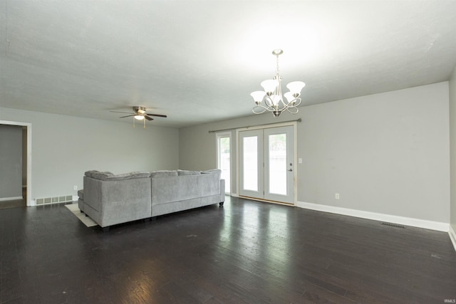 living room with a chandelier, baseboards, dark wood-style flooring, and a ceiling fan