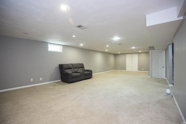 unfurnished room with light carpet, recessed lighting, and baseboards