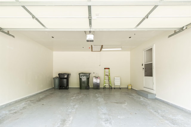 garage featuring baseboards and a garage door opener