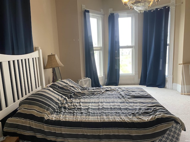 606 E Walnut St, Portland, IN 47371 - bedroom with a chandelier and carpet floors